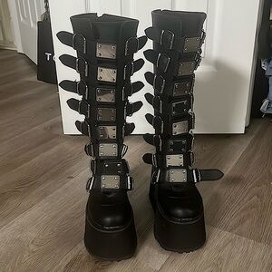DEMONIA ‘Damned-318’ Black Vegan Leather Platformed Boots